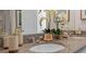 Elegant bathroom with a double vanity and granite countertop, featuring neutral tones at 4185 Singing Mockingbird Blvd, Bartow, FL 33830