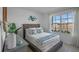 Guest bedroom with a comfortable bed and window looking out to the street at 4185 Singing Mockingbird Blvd, Bartow, FL 33830