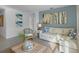 Spacious living room with a light beige sectional and coastal-themed decor at 4185 Singing Mockingbird Blvd, Bartow, FL 33830