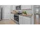 Kitchen with stainless steel appliances and granite countertops at 4185 Singing Mockingbird Blvd, Bartow, FL 33830