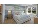 Bright bedroom with a comfortable bed, stylish decor, and large window at 4185 Singing Mockingbird Blvd, Bartow, FL 33830