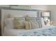 Main bedroom with a plush bed featuring a coastal-themed bedding set at 4185 Singing Mockingbird Blvd, Bartow, FL 33830