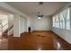 Living room with hardwood floors, fireplace, and staircase at 4458 Philadelphia Cir, Kissimmee, FL 34746