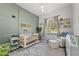 Charming Bedroom with crib, seating, and plenty of storage at 6807 Sylvan Woods Dr, Sanford, FL 32771