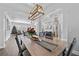 Large dining area with a wooden table and modern light fixture at 6807 Sylvan Woods Dr, Sanford, FL 32771