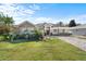 Single-story home with a landscaped lawn and paved driveway at 6807 Sylvan Woods Dr, Sanford, FL 32771
