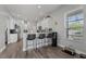 Bright kitchen with white cabinets and breakfast bar at 6807 Sylvan Woods Dr, Sanford, FL 32771