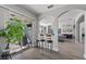 Kitchen with breakfast bar and view of living room at 6807 Sylvan Woods Dr, Sanford, FL 32771