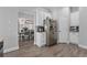 Well-equipped kitchen, stainless steel appliances, white cabinets, and wood flooring at 6807 Sylvan Woods Dr, Sanford, FL 32771