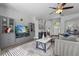 Spacious living room with a sectional sofa, a large TV, and hardwood floors at 6807 Sylvan Woods Dr, Sanford, FL 32771