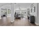 Spacious living area with hardwood floors, large windows, and comfortable seating at 6807 Sylvan Woods Dr, Sanford, FL 32771