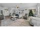 Open concept living room featuring hardwood floors and views into other areas at 6807 Sylvan Woods Dr, Sanford, FL 32771