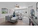 Open living room boasting a sectional sofa, a Christmas tree, and ample natural light at 6807 Sylvan Woods Dr, Sanford, FL 32771