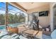 Screened-in pool area with patio furniture and grill at 6807 Sylvan Woods Dr, Sanford, FL 32771