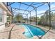 Relaxing kidney-shaped pool with screened enclosure at 6807 Sylvan Woods Dr, Sanford, FL 32771
