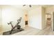 Home gym setup in bedroom with ensuite bathroom and walk-in closet at 7224 Enchanted Lake Dr, Winter Garden, FL 34787