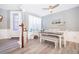 Bright dining area with white table and bench seating at 8391 Riverdale Ln # 10314, Davenport, FL 33896