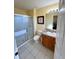 Bathroom with shower, toilet and vanity at 8575 Bay Lilly Loop, Kissimmee, FL 34747