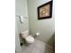 Guest bathroom with toilet and wall decor at 8575 Bay Lilly Loop, Kissimmee, FL 34747