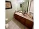 Clean bathroom with vanity, sink, and toilet at 8575 Bay Lilly Loop, Kissimmee, FL 34747