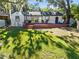 White house with a large deck, perfect for entertaining at 1403 E Pine St, Orlando, FL 32801