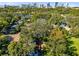 Aerial view of house, deck, and surrounding area with city skyline in background at 1403 E Pine St, Orlando, FL 32801