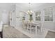 Bright dining room with table and chairs, view to entry at 1455 Resolute St, Kissimmee, FL 34747