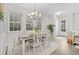 Charming dining room with a farmhouse table and chandelier at 1455 Resolute St, Kissimmee, FL 34747