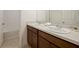 Clean bathroom with double vanity and a bathtub at 14613 Erice Ave, Clermont, FL 34714