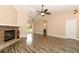 Open concept living room with fireplace and access to backyard at 17646 Washington St, Winter Garden, FL 34787