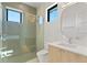 Modern bathroom with patterned tile shower and floating vanity at 1948 Rowena Ave, Orlando, FL 32803