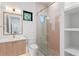 Modern bathroom with pink tile shower and a floating vanity at 1948 Rowena Ave, Orlando, FL 32803