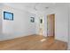 Bright bedroom with hardwood floors and ensuite bathroom at 1948 Rowena Ave, Orlando, FL 32803