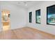 Bright bedroom with hardwood floors and an ensuite bathroom at 1948 Rowena Ave, Orlando, FL 32803