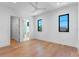 Bright bedroom with hardwood floors and ensuite bathroom at 1948 Rowena Ave, Orlando, FL 32803