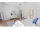 Bright bedroom with queen bed, hardwood floors, and access to bathroom at 1948 Rowena Ave, Orlando, FL 32803