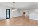 Bright bonus room with hardwood floors, modern light fixture and access to balcony at 1948 Rowena Ave, Orlando, FL 32803