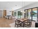 Dining room with wood table and chairs, open to the living room and kitchen at 1948 Rowena Ave, Orlando, FL 32803