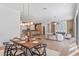 Dining room with wood table and chairs, open to the living room and kitchen at 1948 Rowena Ave, Orlando, FL 32803