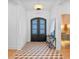 Bright entryway with geometric tile floor and modern console table at 1948 Rowena Ave, Orlando, FL 32803