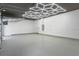 Spacious garage with epoxy flooring and geometric lighting at 1948 Rowena Ave, Orlando, FL 32803