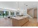 Open floor plan with kitchen island, living area, and pool view at 1948 Rowena Ave, Orlando, FL 32803