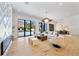 Living room with fireplace, large windows, and pool view at 1948 Rowena Ave, Orlando, FL 32803