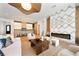 Living room with fireplace, large windows and view of kitchen and pool at 1948 Rowena Ave, Orlando, FL 32803