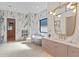 Luxurious bathroom with marble tile and freestanding tub at 1948 Rowena Ave, Orlando, FL 32803