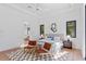 Main bedroom with king bed, hardwood floors, and access to en-suite bathroom at 1948 Rowena Ave, Orlando, FL 32803