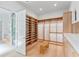 Large walk-in closet with ample shelving and drawers at 1948 Rowena Ave, Orlando, FL 32803