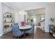 Open concept dining room with round table and gray chairs, offering views of the living room at 2108 Lobelia Dr, Lake Mary, FL 32746