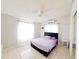 Bedroom with a queen bed, window curtains, and ceiling fan at 2109 Morning Dr, Orlando, FL 32809