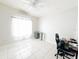 Bright bedroom with tile floors and a workspace at 2109 Morning Dr, Orlando, FL 32809